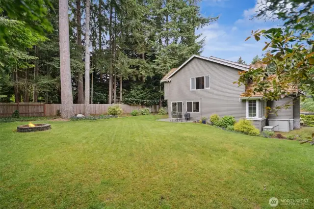 Enjoy the fire pit and the level yard is perfect for lawn games.