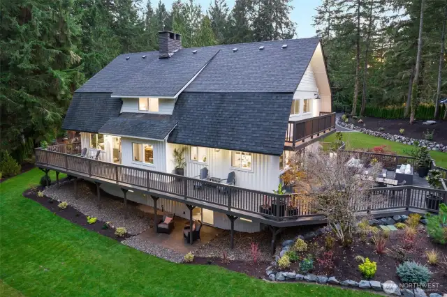 Back of home showcasing wraparound deck