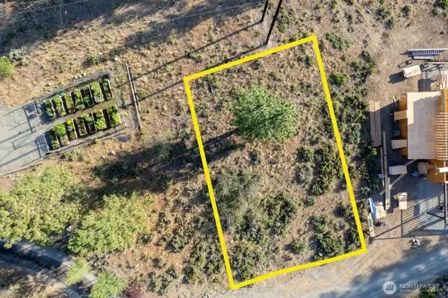 Rendered outline not a survey is an overview of this 7,536 square foot Lot. Next to community garden compound.