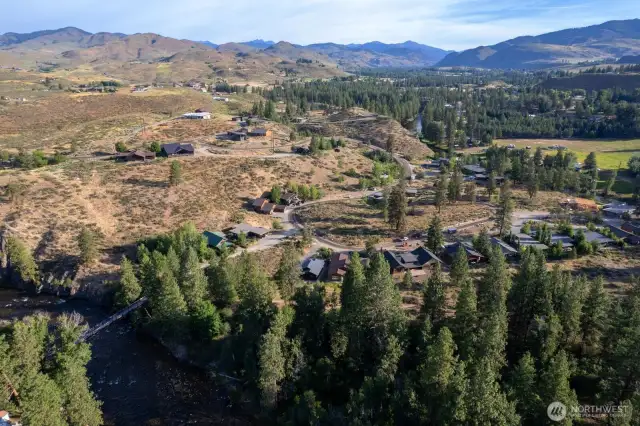 615 Pine Loop is next to the new home construction in upper North view.
