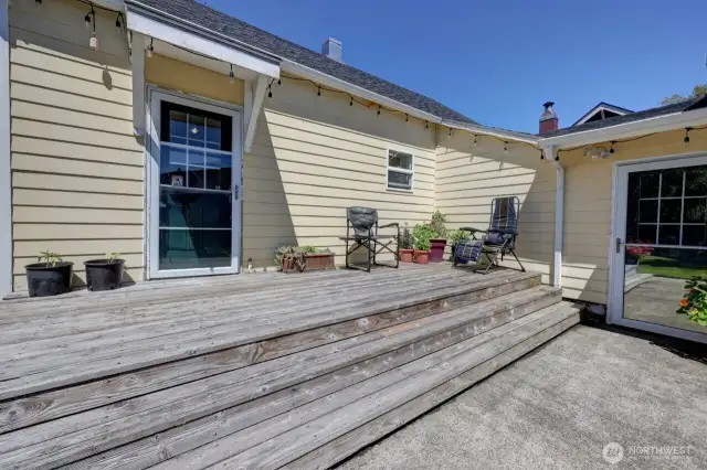 Your south side sunny deck with access to the paved driveway and 2 car garage