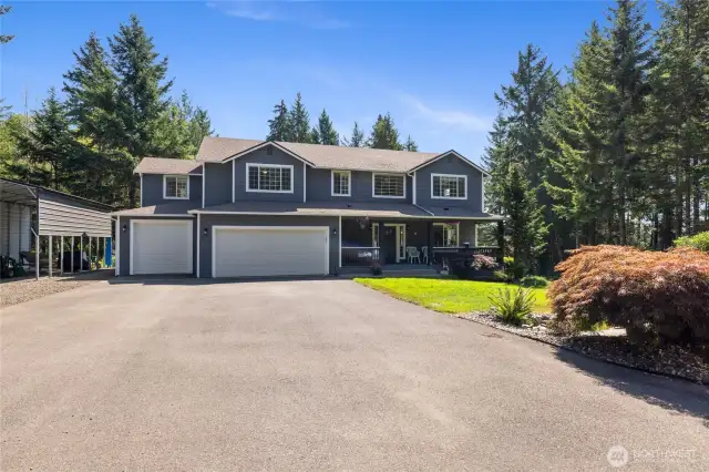 Welcome Home! You could play basketball with all this driveway.