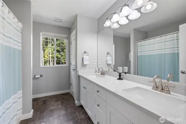 Full guest bath with dual vanities