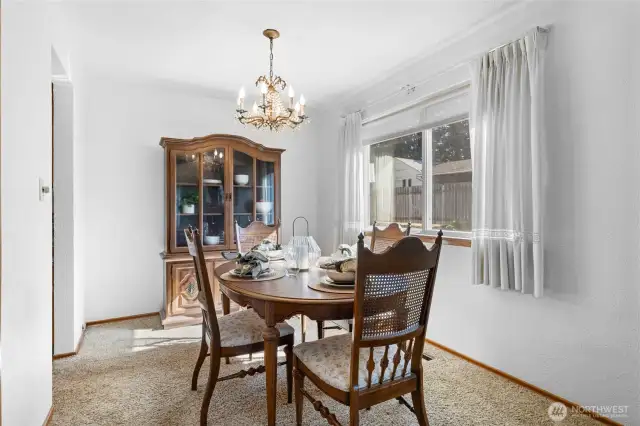 Dining room has hardwood floors under carpet