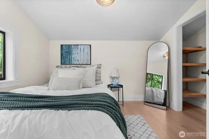 The upstairs bedroom offers plenty of storage for all your needs.