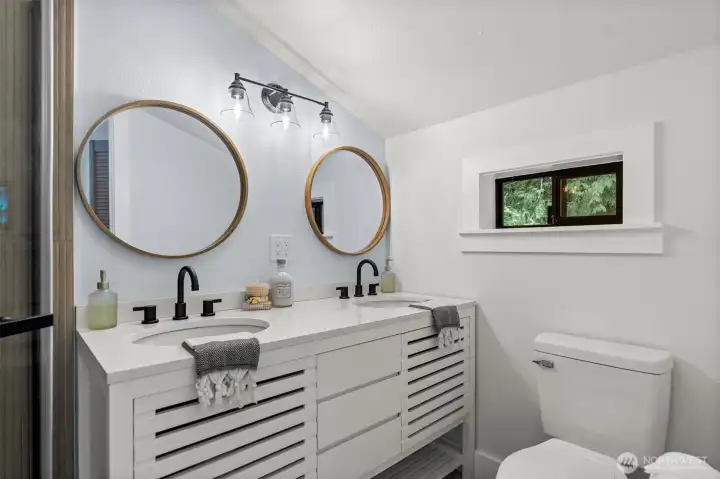 Double sinks make the primary bath functional and luxurious.
