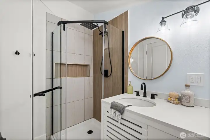 The primary bathroom features a beautiful walk-in shower for a spa-like experience.