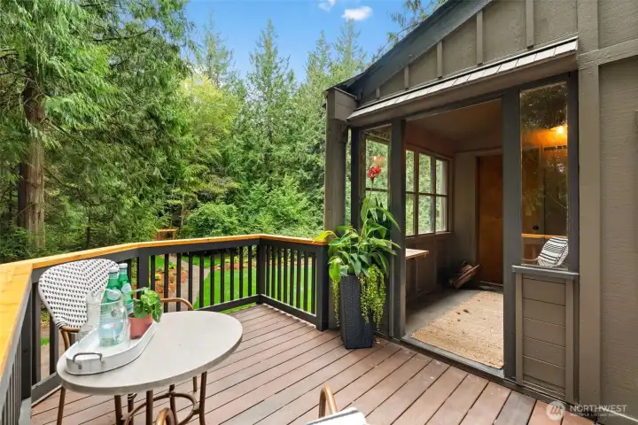 Enjoy the outdoors from this charming sitting nook off the newly installed Trex deck.