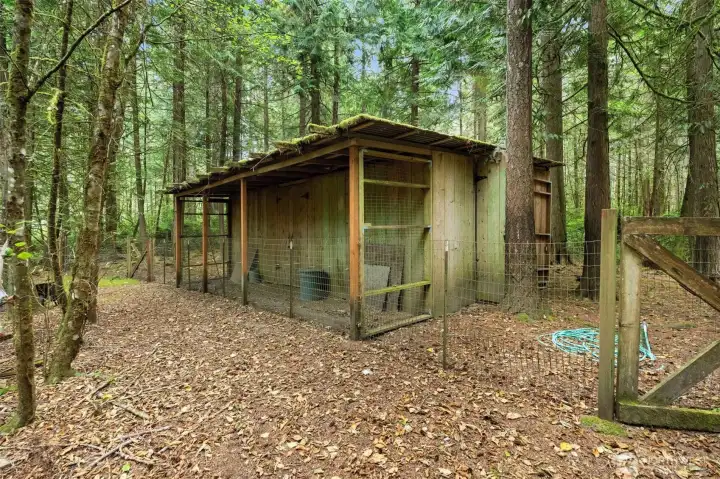 A large chicken coop and charming little barn make this property ideal for a hobby farm.