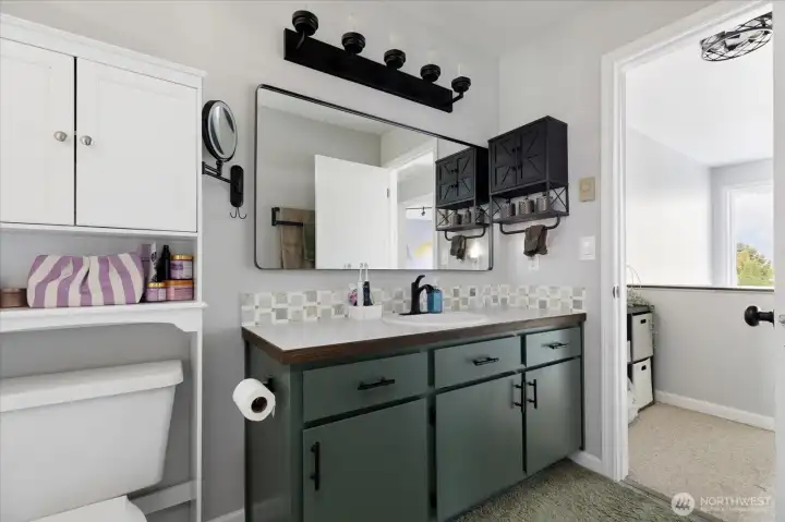 An updated bathroom is shared between the primary bedroom and second bedroom.