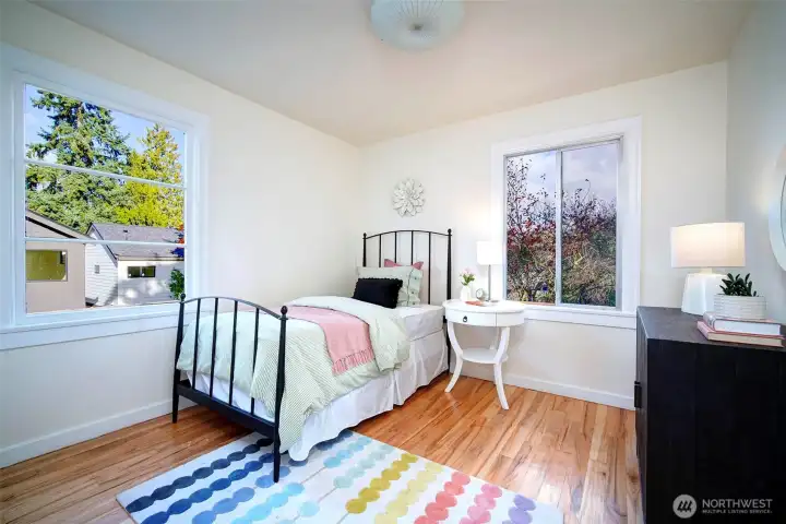 The NE facing 2nd bedroom on the main floor has windows overlooking the backyard