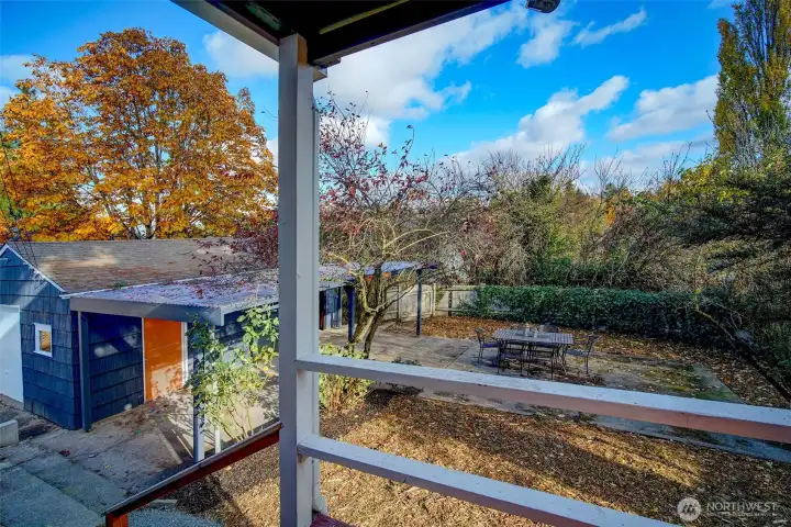 View from backporch towards the large, detached garage. Imagine your home office or yoga studio across that yard!