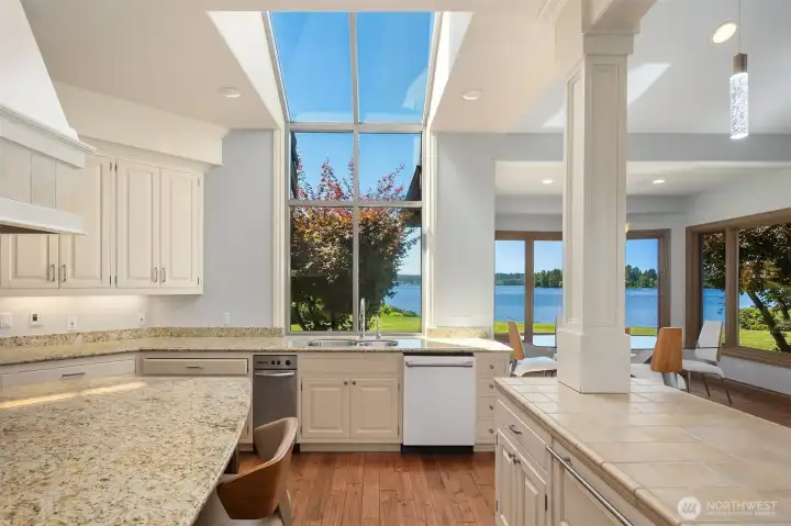 Velux skylights fill the great room w/natural light. Kitchen-aid trash compactor & Bosch dishwasher.