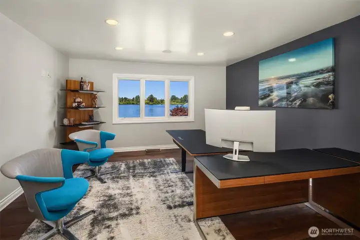 Previously used as a playroom, this bonus room now serves as an office space.