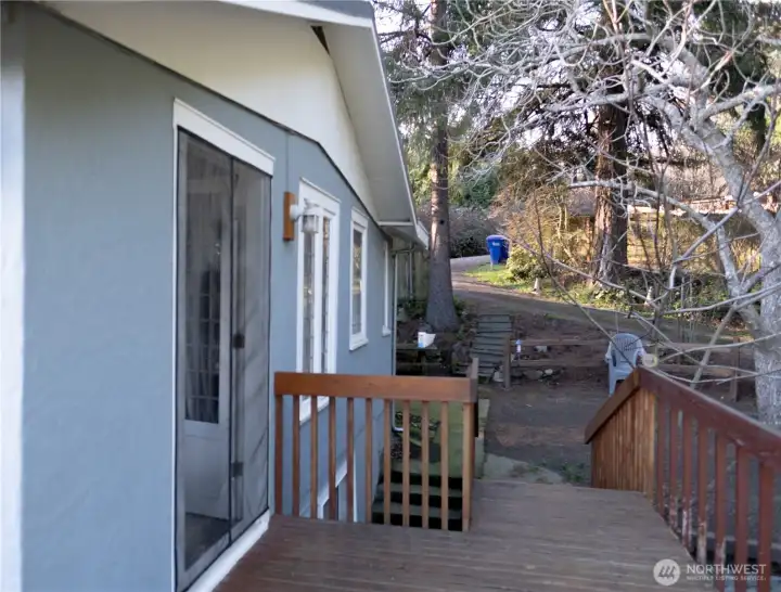 Large deck connects to the interior of cabin.