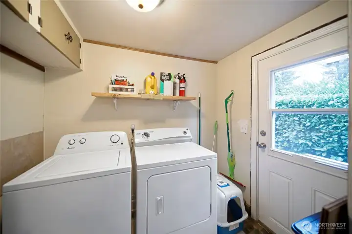 Laundry room with exterior access.