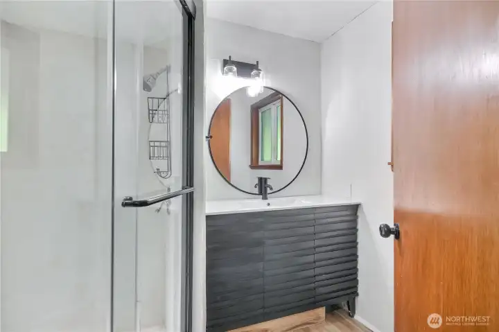 Newly remodeled trendy modern 3/4 bedroom off of the kitchen.