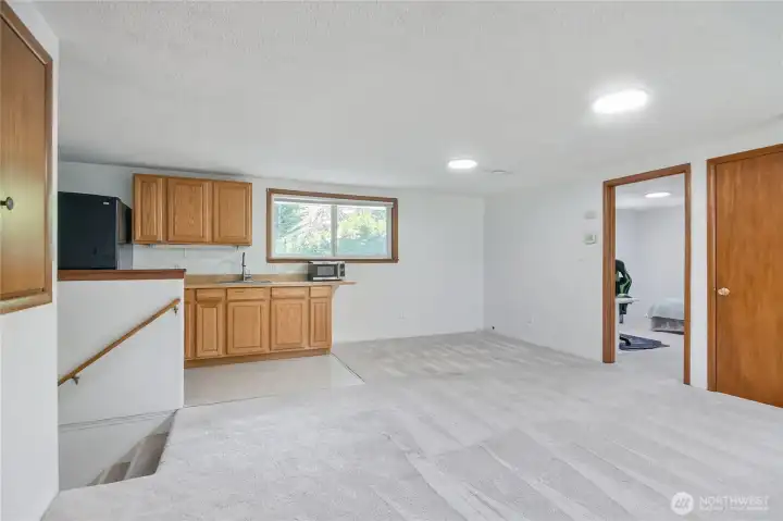 Upstairs private guest quarters w/ 2 bedrooms, great room, micro kitchen & 3/4 bathroom.