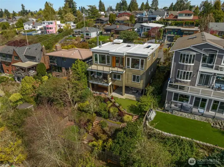 The professionally landscaped terraced yard provides a serene, thoughtfully curated space to connect with nature.