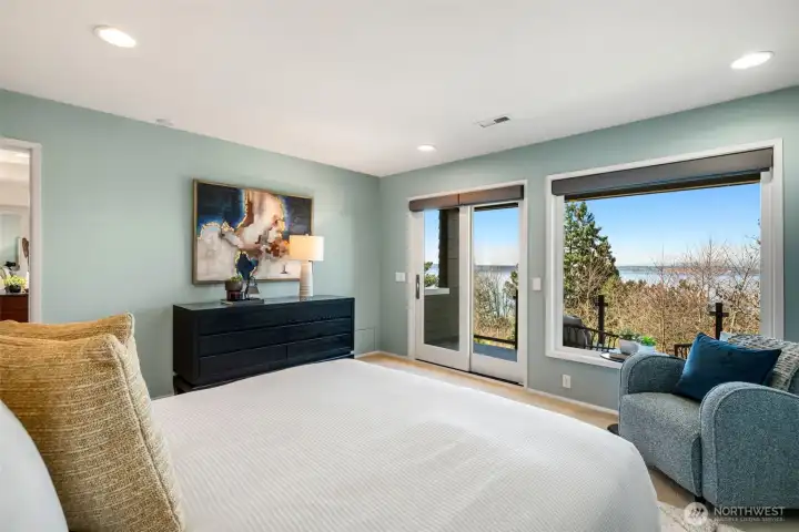 The primary suite offers a true oasis with a private deck, generous custom walk-in closet, and a spa-inspired bath designed for relaxation