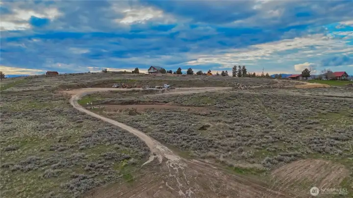 Road is in to two leveled areas with ready RV power to both & water on top leveled area