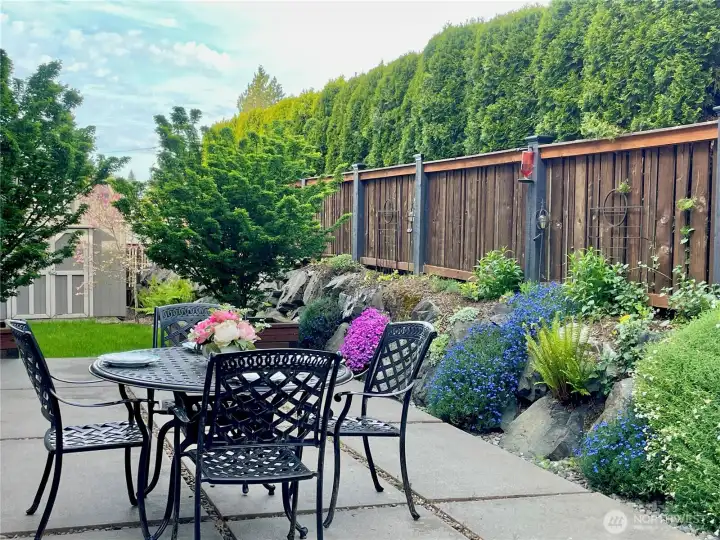 Relax on this gorgeous and private patio with small lawn and custom built shed!