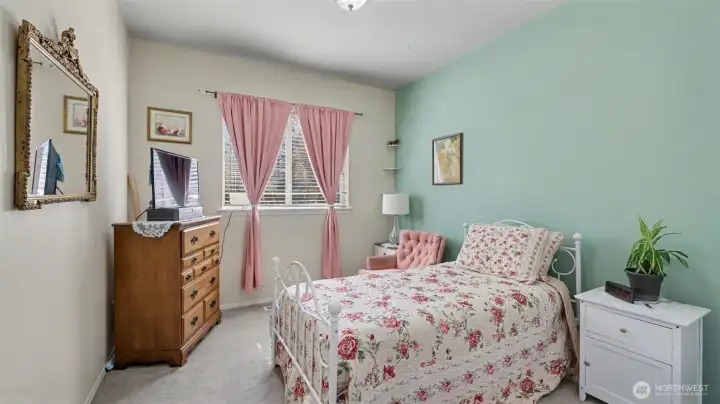 Main floor guest bedroom #1. Great for multi-generational living or an office.