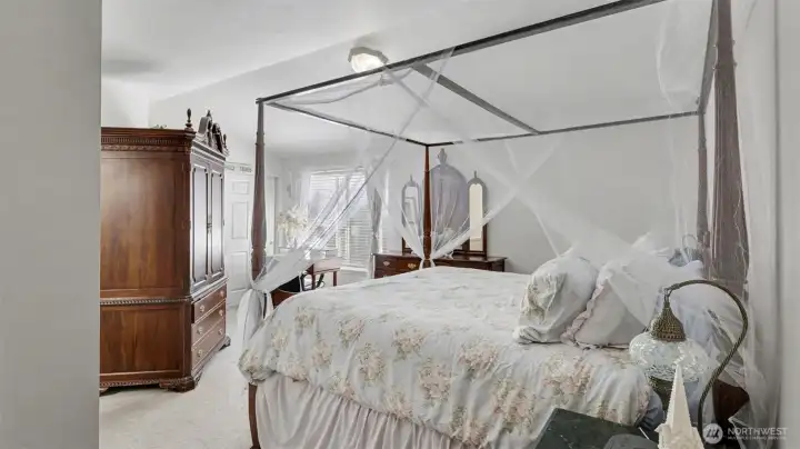 The primary suite features two closets and an updated bath with laminate hardwoods, while a convenient upstairs laundry room adds ease to daily routines.