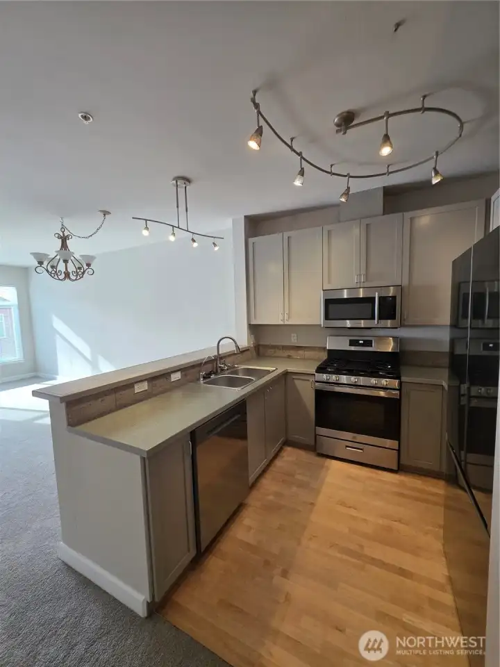 Updated kitchen with bar to dining area.