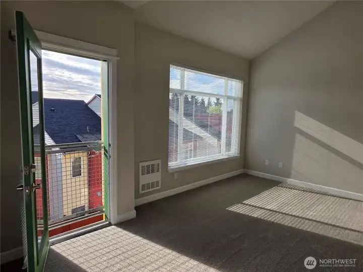 Primary suite with balcony to let in the fresh spring air.