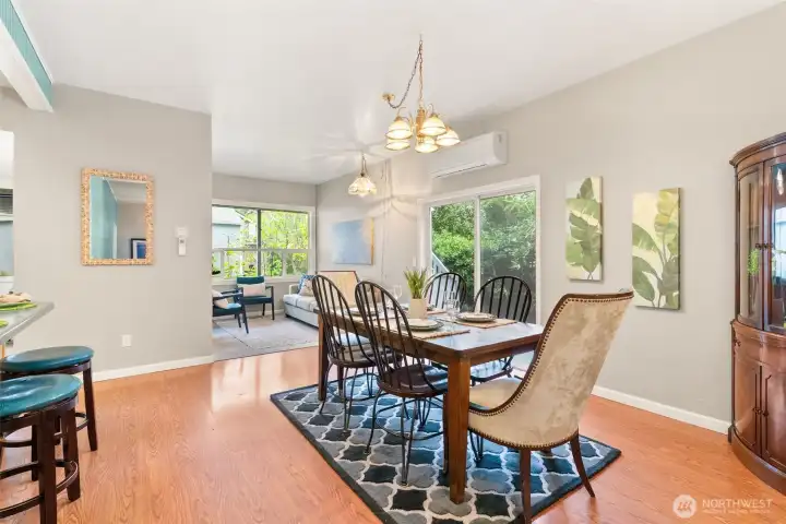 Open dining area with abundant natural light and seamless access to the outdoor living space.
