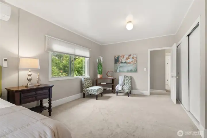 Thoughtfully sized primary bedroom with added space for lounging or quiet retreat