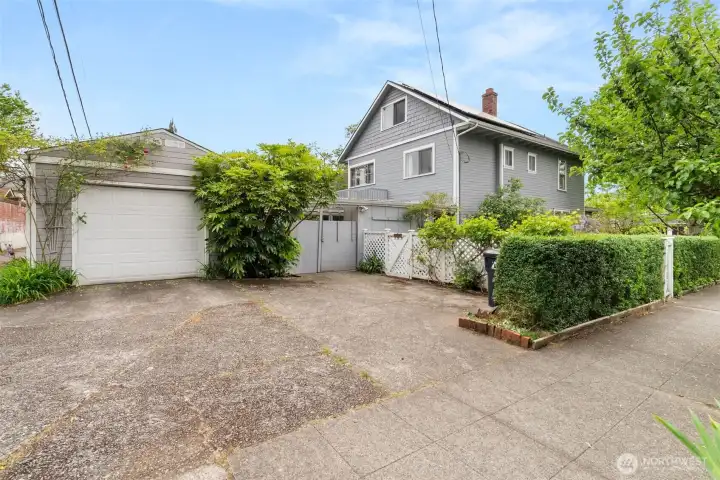 Generous driveway and detached garage provide added parking and storage flexibility