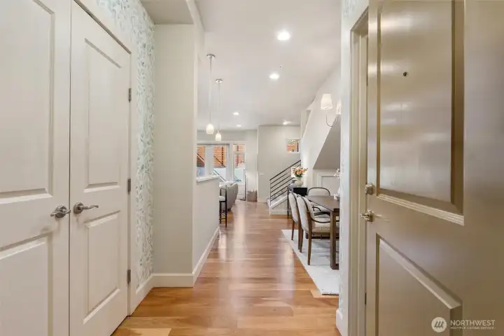 Entryway with a coat closet on your left and a large walk-in pantry/storage closet on your right.