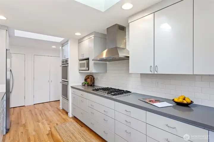 Beautiful subway backsplash, KWC AVA hardware and a farmers sink situated strategically under the large kitchen windows, this kitchen is dream come true...and if that is not enough, look at all that pantry space!
