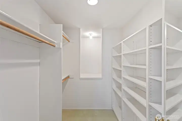 Another walk-in closet with built-ins and a large storage space in the back for those big suitcases and other travel needs.