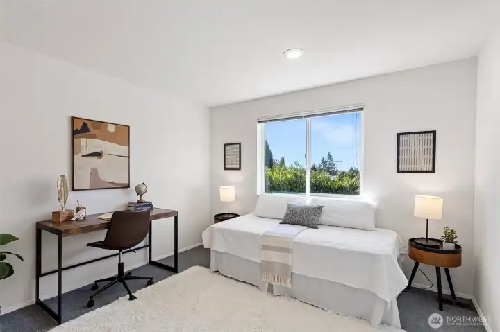 Bedroom 4 - This one also has a VIEW! Enjoy lyinig in bed or sitting at your desk while enjoying the wonderful view of Mount Rainier as the light changes and reflects on it throughout the day. Lake WA can also be seen from here, although a peek-a-boo view.