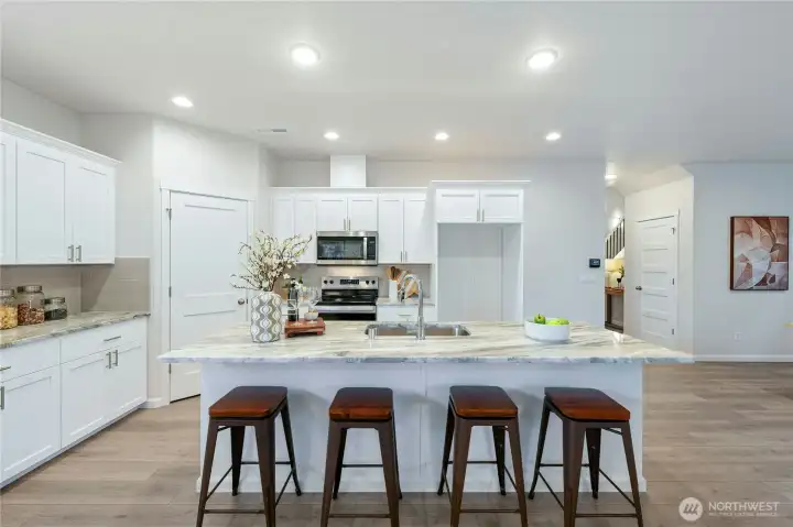 **Lot 13 is a presale** Photos are of the same floorplan in the community. Some features and colors will vary.