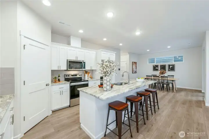 **Lot 13 is a presale** Photos are of the same floorplan in the community. Some features and colors will vary.