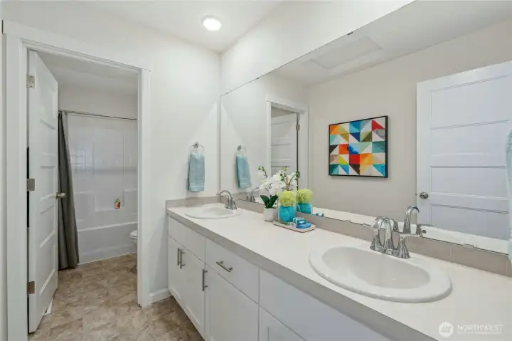 **Lot 13 is a presale** Photos are of the same floorplan in the community. Some features and colors will vary.