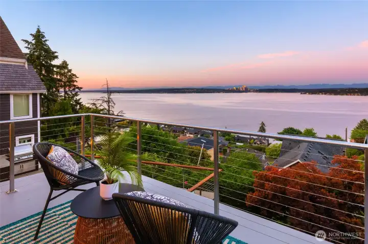 Wake to stunning views from the primary suite's private deck.