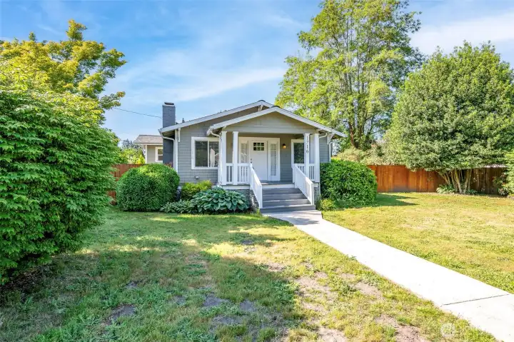 Built on a large corner lot with mature landscape