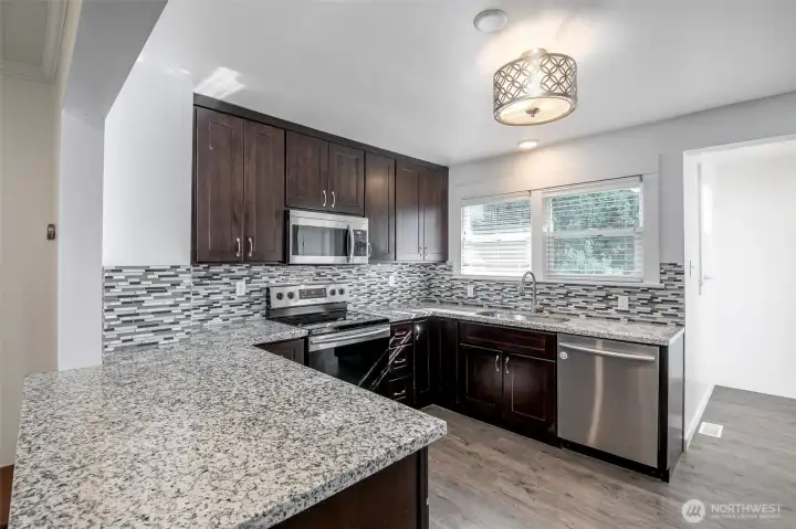 Kitchen with granite countertops and stainless steel appliances
