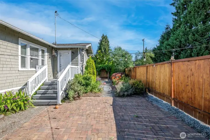 Back door from house to paver patio and walkway to firepit