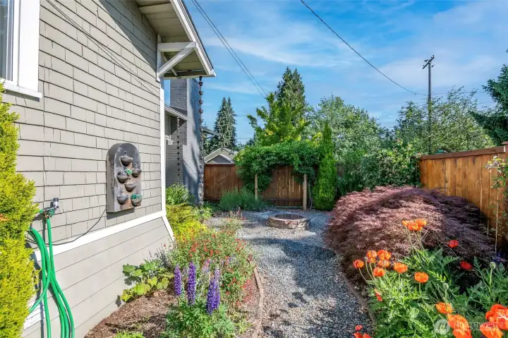 Beautiful perennial plantings adorn the garden walkway
