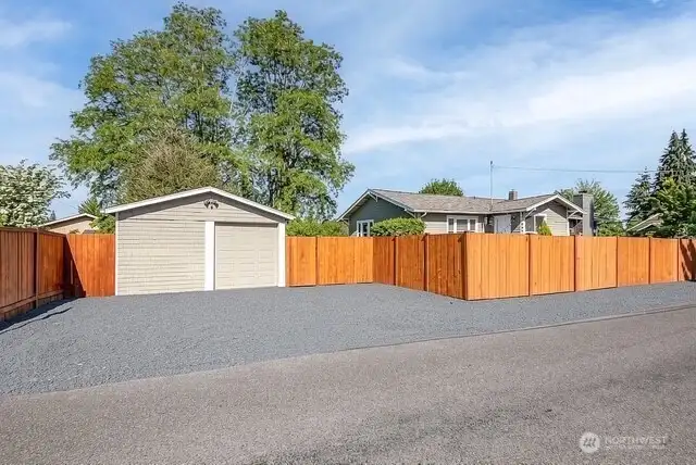 Detached one car garage with shop space and parking for additional vehicles and toys