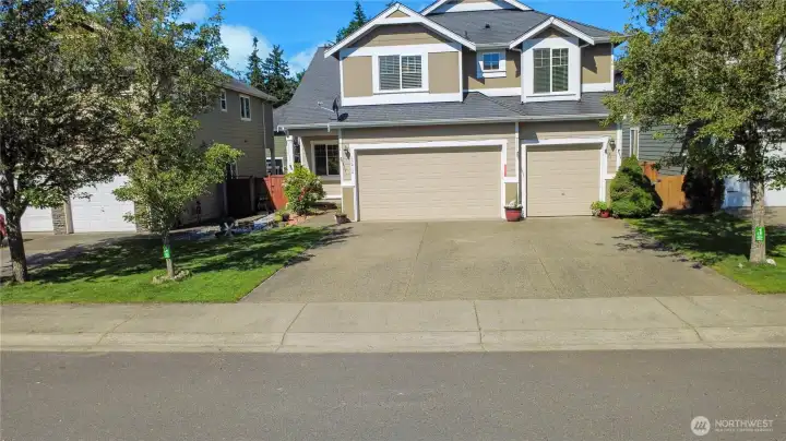 Gorgeous 2600 sqft 4 bedroom + office home with THREE CAR garage and a FLAT drive way!