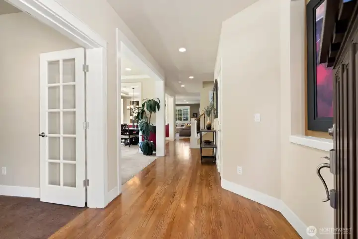 Gleaming real hardwoods greet you.