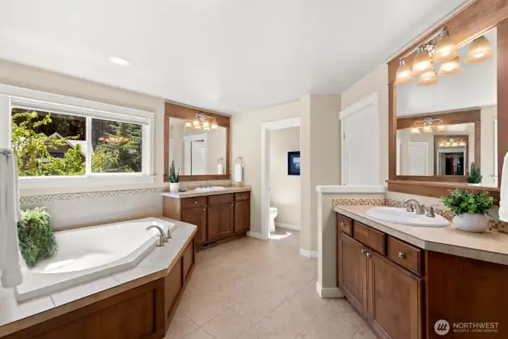 Dual separate vanities so you don't have to compete.