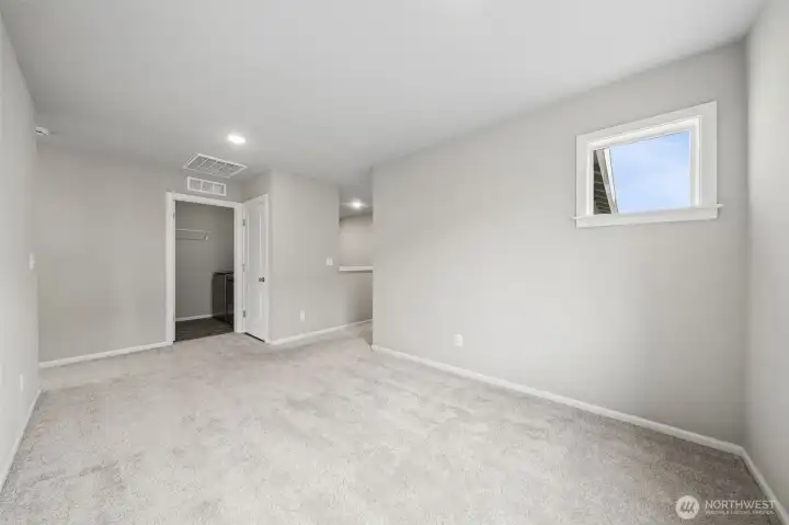 Another view of the loft with laundry room in the distance